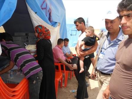 A young Iraqi couple from Mosul check into Kelek camp after arriving on foot. 13 June 2014
