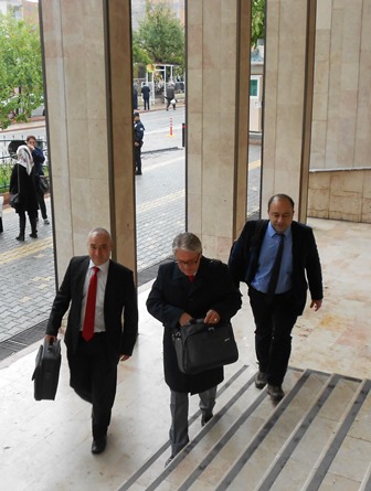 A Turkish Protestant pastor arrives with plaintiff lawyers
Murat Dincer (c) and Erdal Dogan (r) on Oct. 15 for the
Malatya trial.