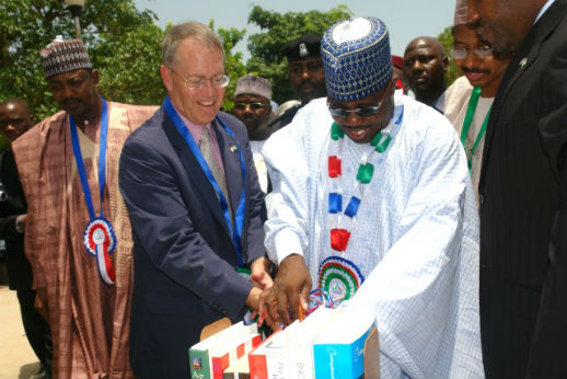 Ali Modu Sheriff, in light-colored traditional dress, foreground, opens a library in Maiduguri, Borno state, in 2007.