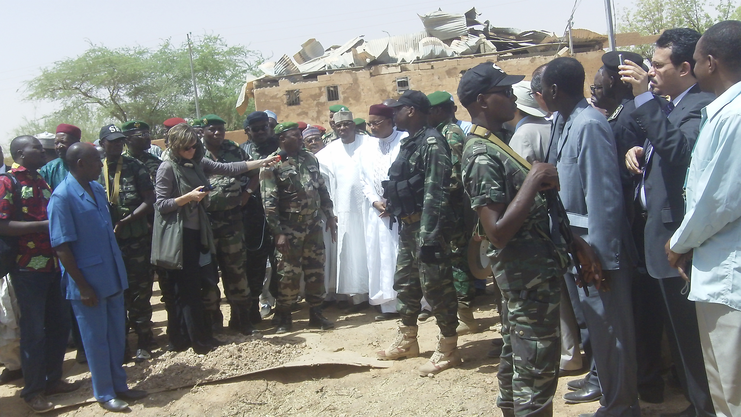 Niger President Mahamadou Issoufou, centre, at scene of the suicide blast in Agadez