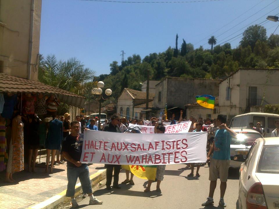 A march of protest followed the the picnic in Aokas, near Béjaïa. The sign translates: 'Stop Salafists and Wahabites', two Islamist groups.