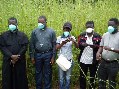 Mgr Dieudonne Nzapalainga, the Archibishop of Bangui, second from left, paid his respects at this burial in Bossangoa.