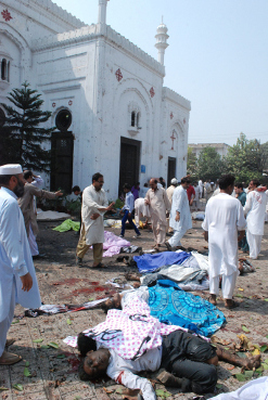 The carnage outside All Saints Church after the bomb blast.