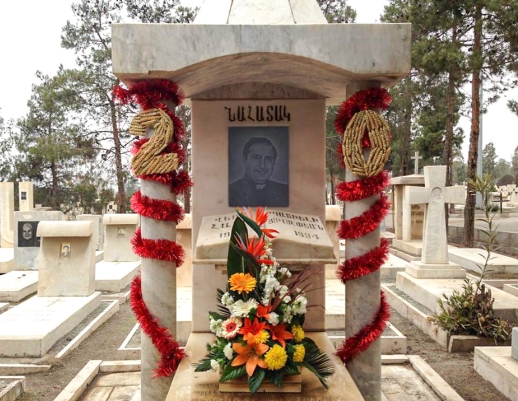 Flowers were placed upon Haik Hovsepian's grave during a memorial service in Tehran on Sunday.