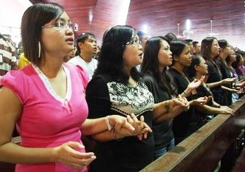 Christians in Sarawak attend Mass at St. Joseph's Cathedral in Kuching. The service is held in the Malay language, which uses the word 'Allah' for God.