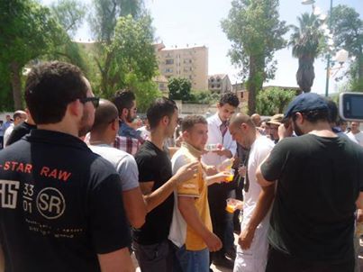 Protesters in Tizi Ouzou share soft drinks during Ramadan.