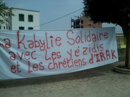 The banner reads: 'Kabylie in solidarity with Iraqi Yezidi and Christians' 