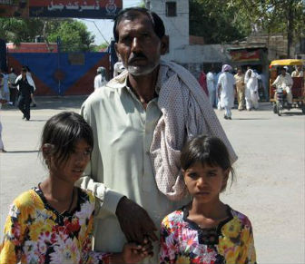 Ashiq Masih, husband of Asia Noreen, and their two daughters in a 2010 photo