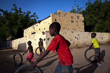 Children play by bullet riddled Police Station in Gao, Mali. August 28, 2013 