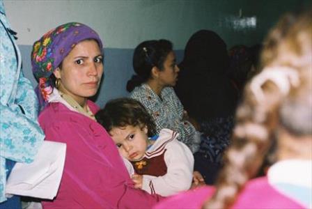 Woman and child in a church service in Upper-Egypt; December 2003 