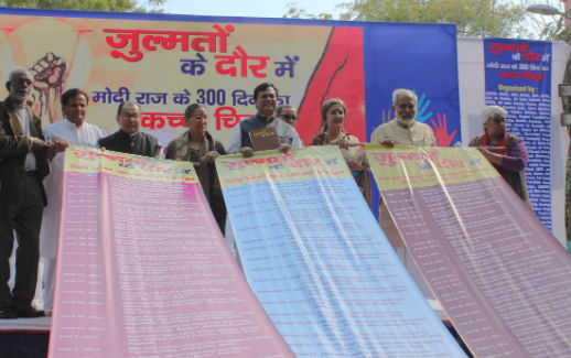 At a March 19 rally in New Delhi, Christian and Muslim activists unfurl a list of what they consider atrocities against religious minorities during the first 300 days of rule under India's Bharatiya Janata Party.