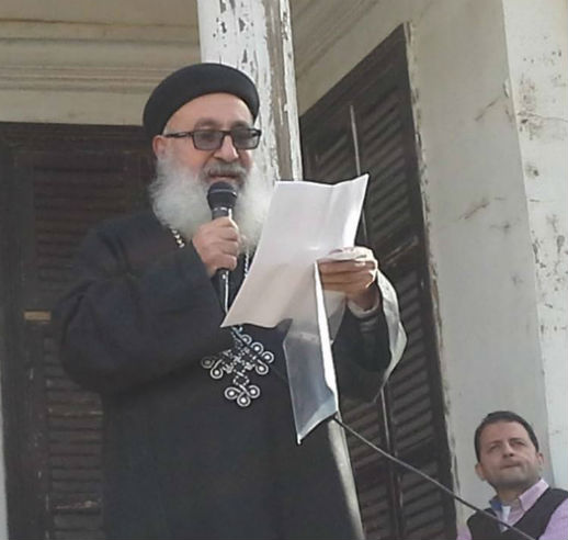 Rev. Azer Tawadros, a Coptic priest, reads a statement at the reconciliation meeting.