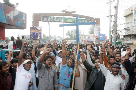 Christians protest outside Yahounabad district, following the deadly church bombings on 15 March.