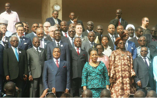 Delegates to a national reconciliation forum in Bangui, Central African Republic, stand for the official portrait. At front is the mediator, Congo President Denis Sassou Nguesso (red tie), and CAR interim President Catherine Samba Panza (turquoise suit).