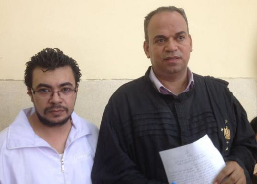 Hegazy (left) with his lawyer Karam Ghobrial, 2014