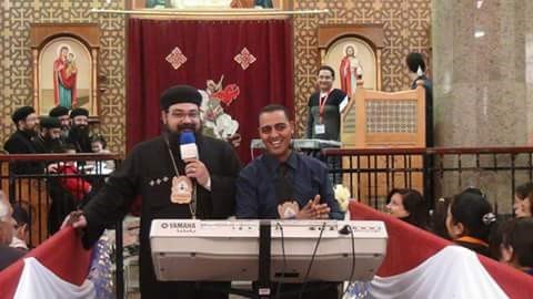 Bahaa Silvanus, right, at the center of the music during a church conference.