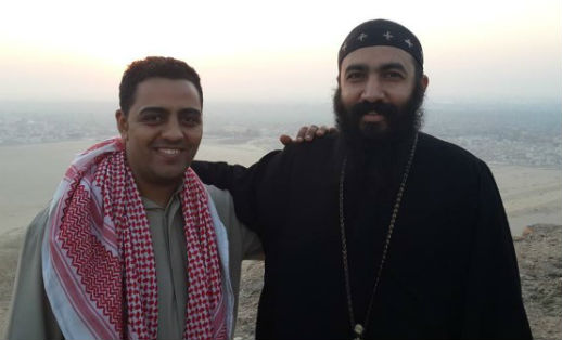 Bahaa Silvanus, left, with Coptic priest Rev. Shenouda Samir in an undated photo. 