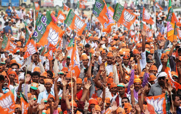 BJP supporters gather in Amethi, Uttar Pradesh, in May 2014 to listen to Narendra Modi speak shortly before his election victory.