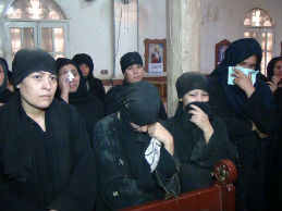 Women mourning during the brothers' funeral