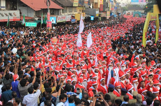 Thousands of Santa Clauses parade through the streets of Thrissur, Kerala state, in 2014.