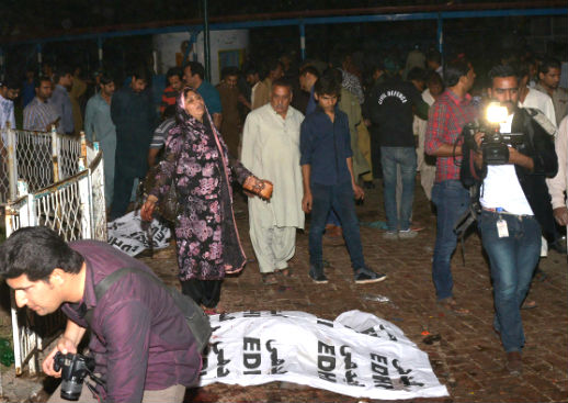The aftermath of a bomb blast in the middle of a popular Lahore amusement park packed with people on Easter Day. 