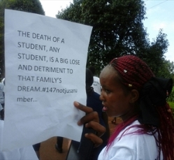Mourners held placards which read: 'The death of a student, any student, is a big loss and detriment to that family's dream. #147notjustanumber'.