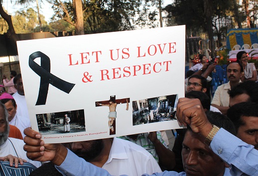 A message is held aloft at a protest march against anti-Christian violence - in Bangalore in February 2015.