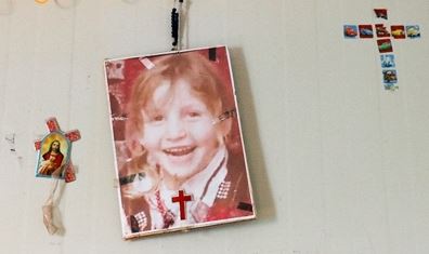 Christine's photo hangs on the wall of her family's caravan, a faint reminder of the lost child.