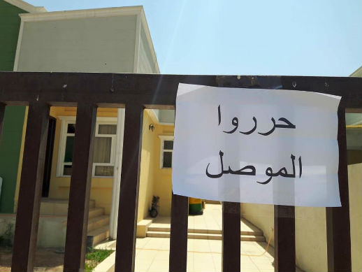Displaced Iraqi Christians 
in Kurdistan hung "Liberate Mosul" signs in August.