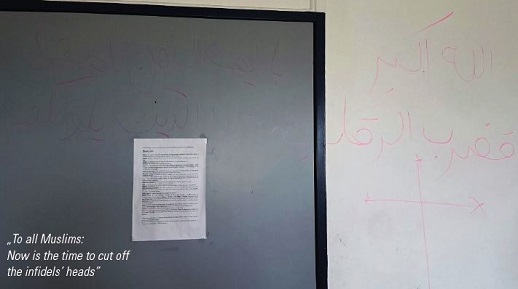 A message 
on the walls of the Rotenburg an der Fulda refugee centre, which translates: 'To all Muslims: Now is the time to cut off the infidels' heads'.