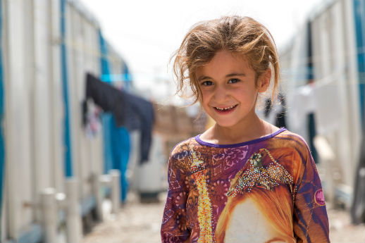 A girl in Ashti 
camp, near Erbil, where about 1,000 caravans house Christian refugees.