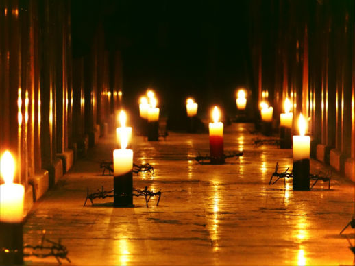 Candles in the aisle of a church in Aleppo during a prayer meeting.