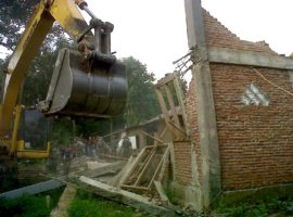 Church walls go up, then torn down by local government