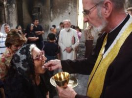 In violence-racked Baghdad, the few Christians still there struggle to cope