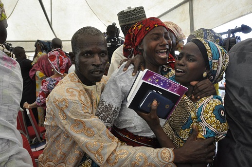 Joy and tears as a family reunite with one of the released Chibok schoolgirls, Abuja, Nigeria, Oct. 2016. 