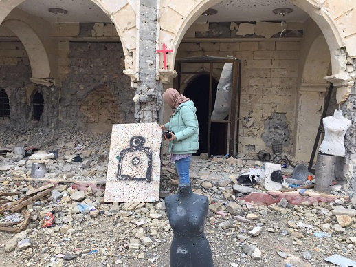 Dr. Sarah Ahmed at the cathedral in Qaraqosh, where IS appeared to have used mannequins looted from a local tailor's to practise shooting.