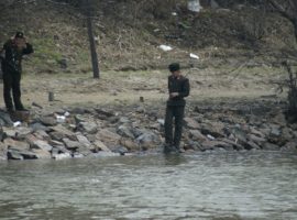 North Korean soldiers patrol the Yalu River on the Chinese-North Korean border