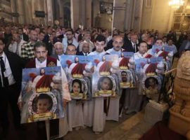 During Easter Mass in St. Mark’s Cathedral in Alexandria deacons carried pictures of the seven people killed in the Palm Sunday attack. Photo: Open Doors International