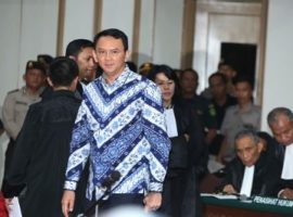 Jakarta's governor arrives in court for his verdict and sentence in his blasphemy trial. Photo: Getty Images
