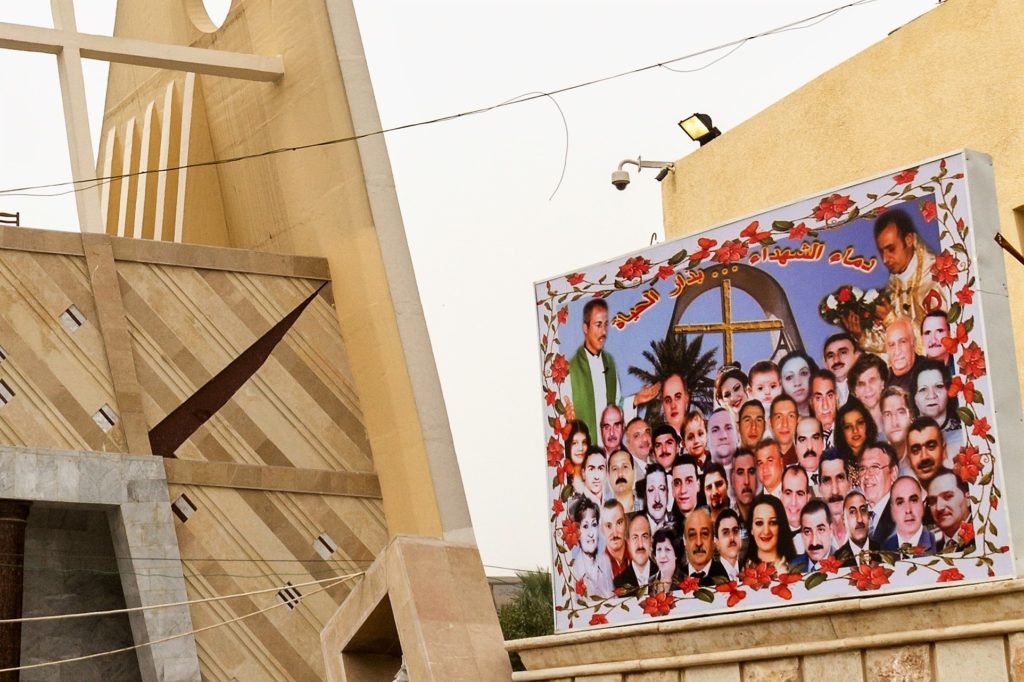 Baghdad's Syriac Catholic church where 58 people died during an attack by six suicide bombers in 2010. The 41 Christians killed in the attack are remembered in a photographic montage next to the entrance (WWM)