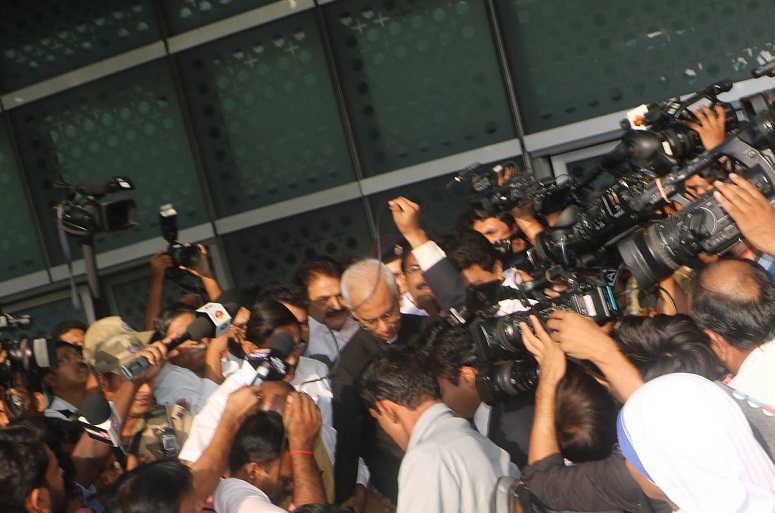Dozens of journalists jostled for photos and videos as the priest was led outside through the VIP gate of the Indira Gandhi International Airport in New Delhi yesterday morning (28 September). (World Watch Monitor)