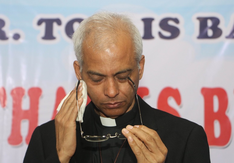 Fr Tom wipes tears at provincial house in Bangalore (World Watch Monitor)