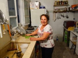 Basima in her renovated kitchen. (Photo: World Watch Monitor)