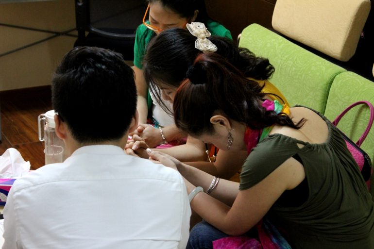 Group of Christians praying together in Beijing. (Photo: World Watch Monitor)