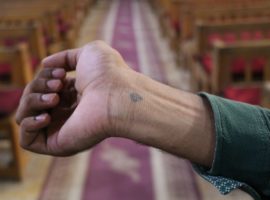 A Coptic cross tattooed on a wrist, like the one hat killed Bassem. (Photo: World Watch Monitor)