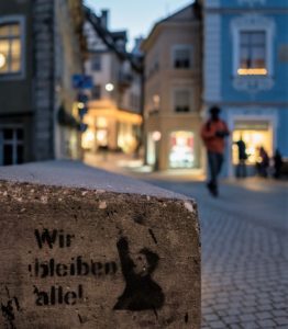 Graffiti of the Wir bleiben alle movement, which expresses solidarity with refugees in Germany(CC/Flickr/Matthias Ripp)