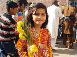 A girl is preparing to walk in the Palm Sunday procession through her Christian neighbourhood in Lahore, Pakistan. (Photo taken from UCAN video)