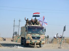 Army truck with Iraqi flag on its way in the direction of Mosul. (Photo: World Watch Monitor)
