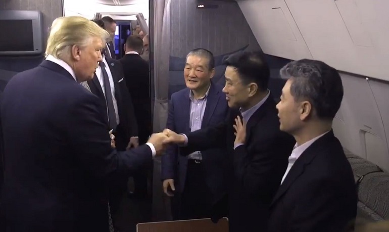 US President Trump welcomes the three released detainees shortly after their plane has landed at the Andrews Air Force Base near Washington.