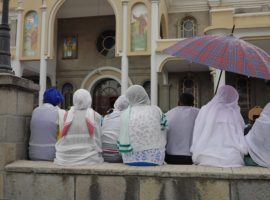 Women sitting in front of the Holy Saviour Orthodox Church in Ethiopia's capital Addis Ababa. (Photo: World Watch Monitor)